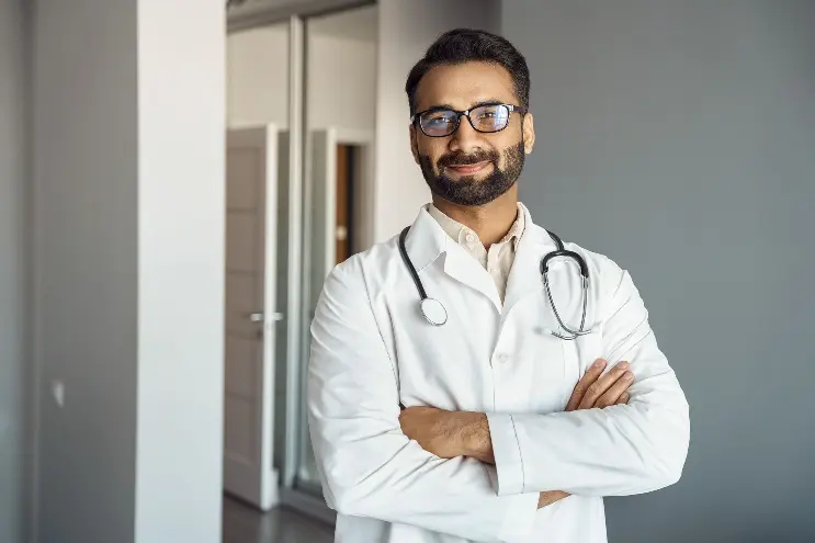 Doctor smiling with arms crossed