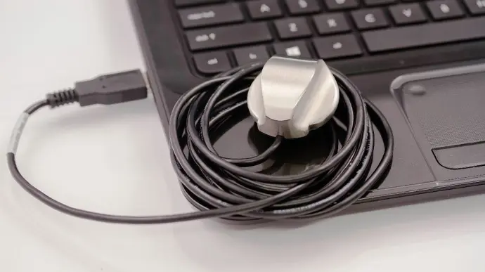 Digital stethoscope resting on a laptop