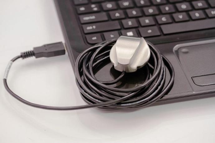 PCP-USB Stethoscope resting on a laptop.