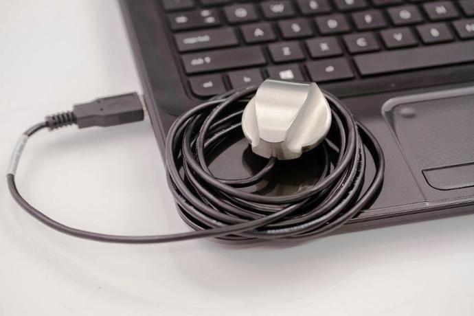 PCP-USB Stethoscope PCP-USB Stethoscope resting on a laptop.